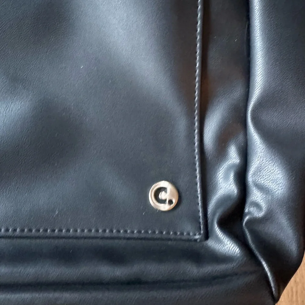 Corkcicle Black Commuter Backpack with Disney Destinations Logo